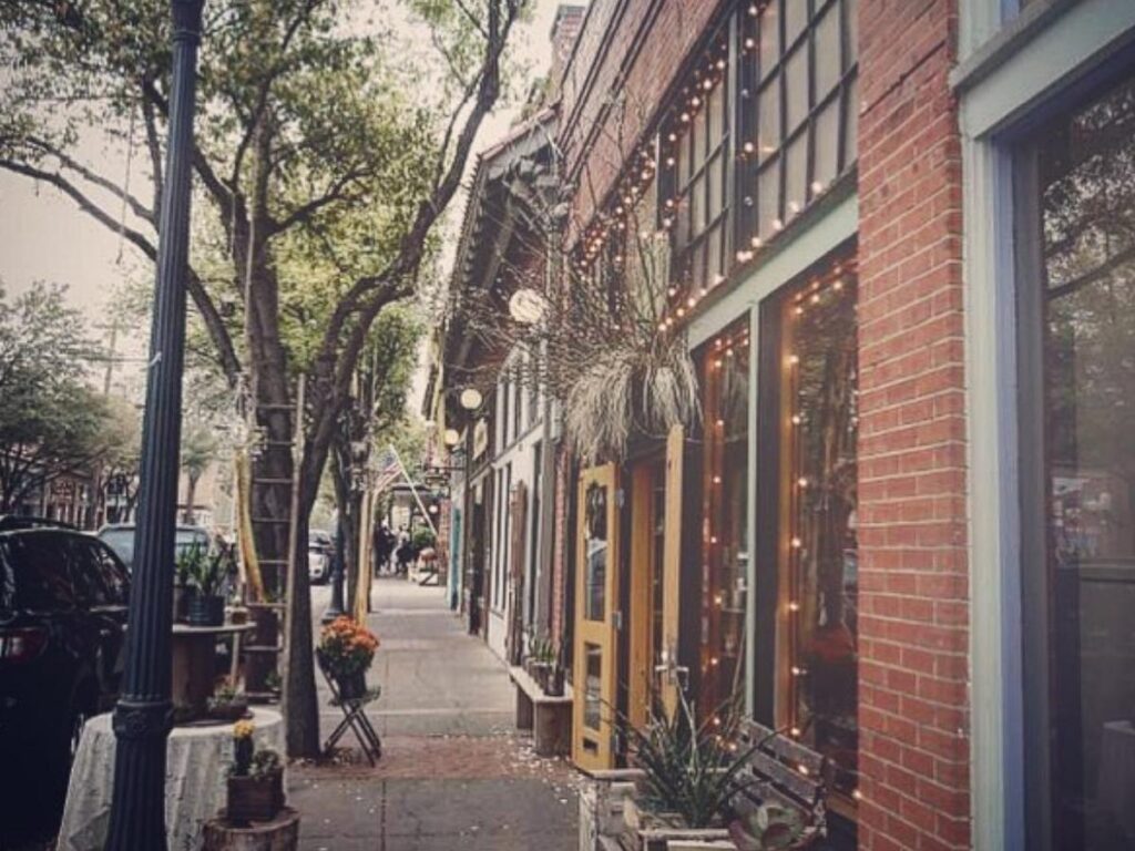Shops and restaurants along a colorful street in Bishop Arts District.