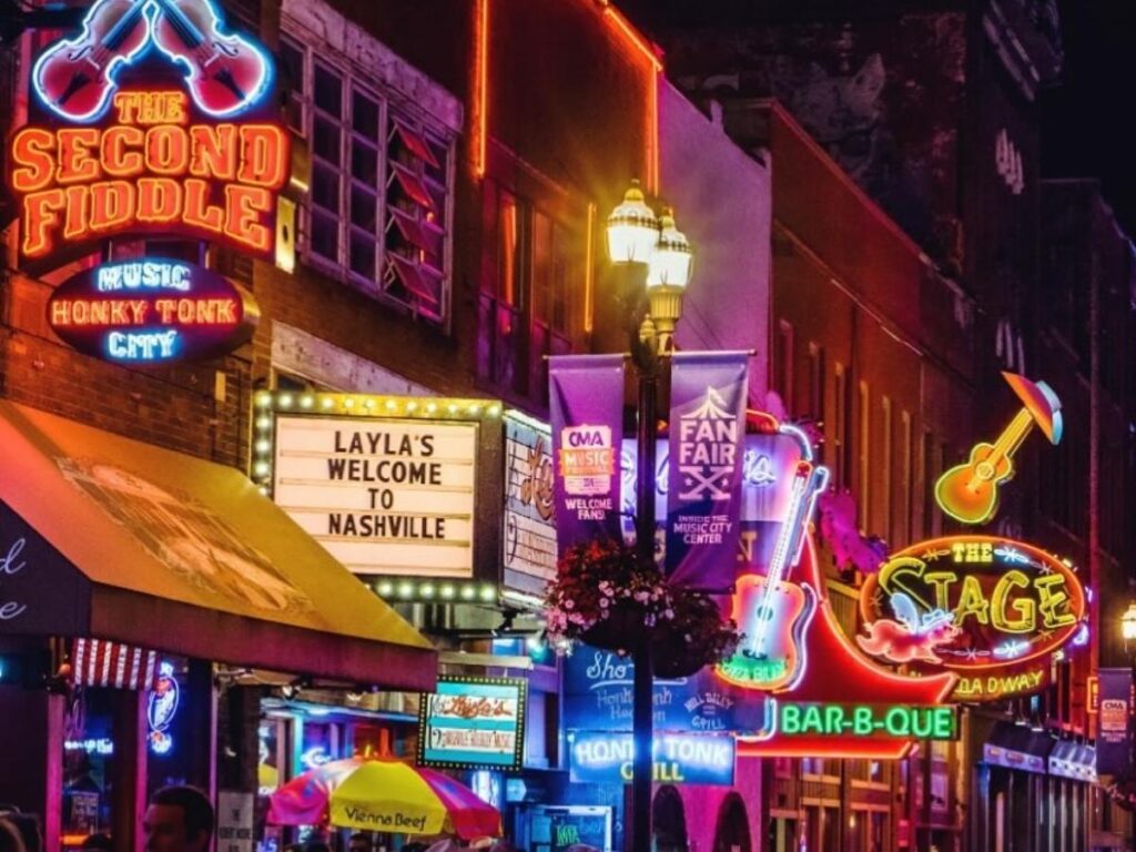 Neon signs and live music venues along Broadway in Nashville