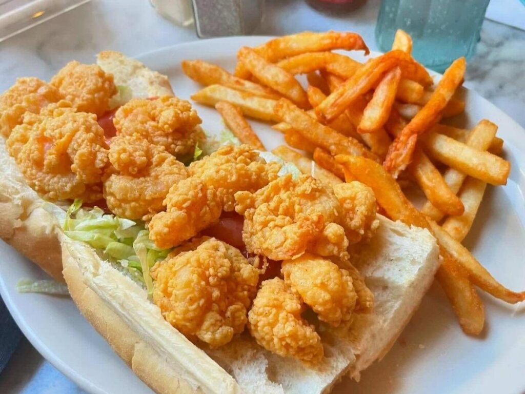 A classic New Orleans po’ boy sandwich served on crusty bread at a neighborhood eatery