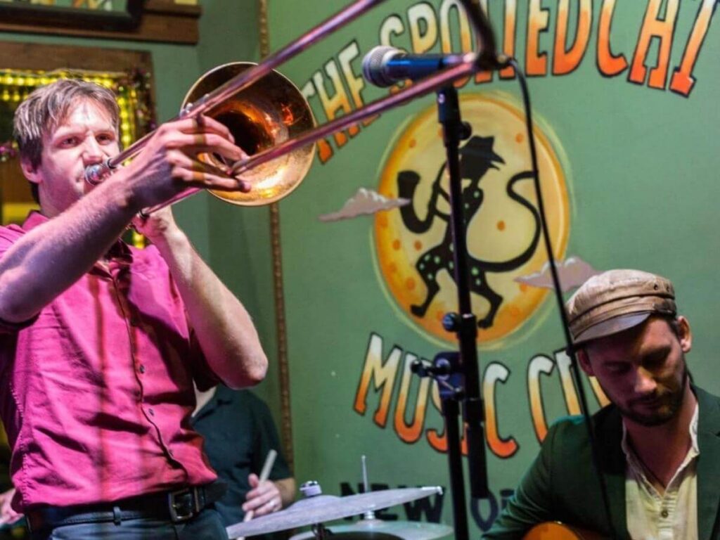 Live music and small crowds along Frenchmen Street in the evening
