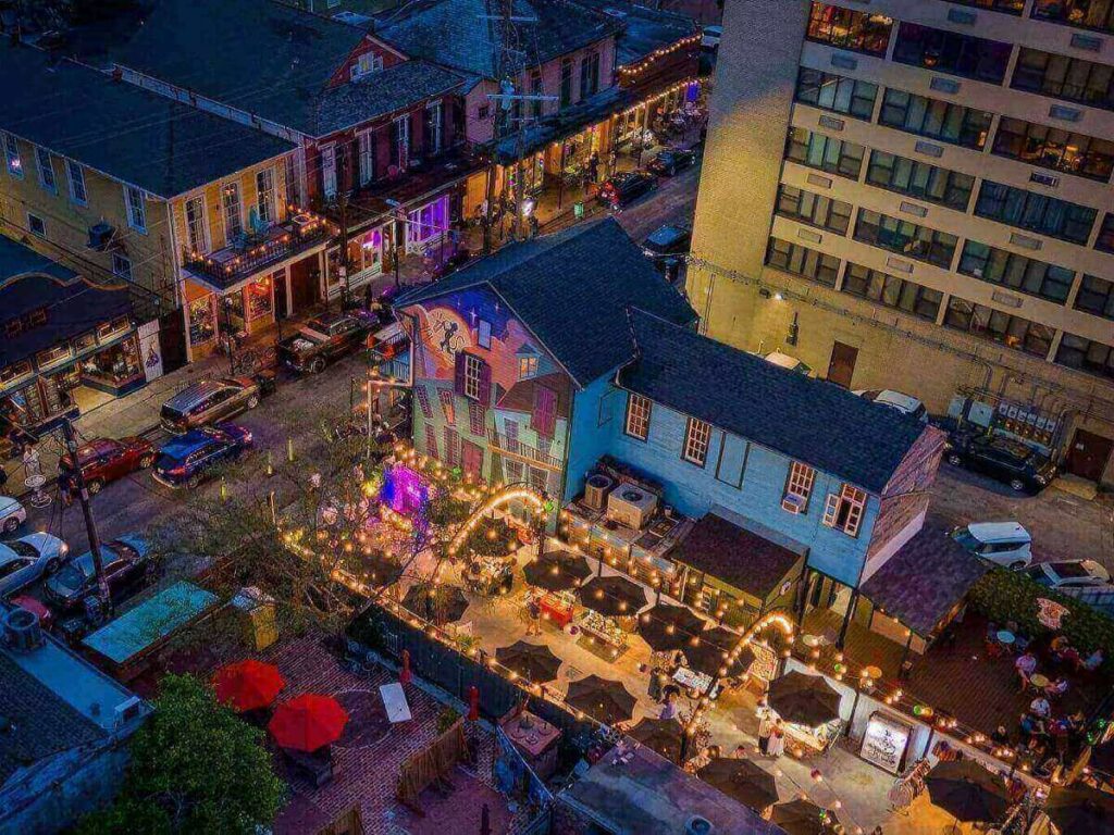 Live music spilling onto Frenchmen Street at night in New Orleans.