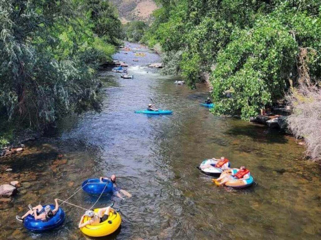 Clear Creek running through downtown Golden Colorado with mountains behind