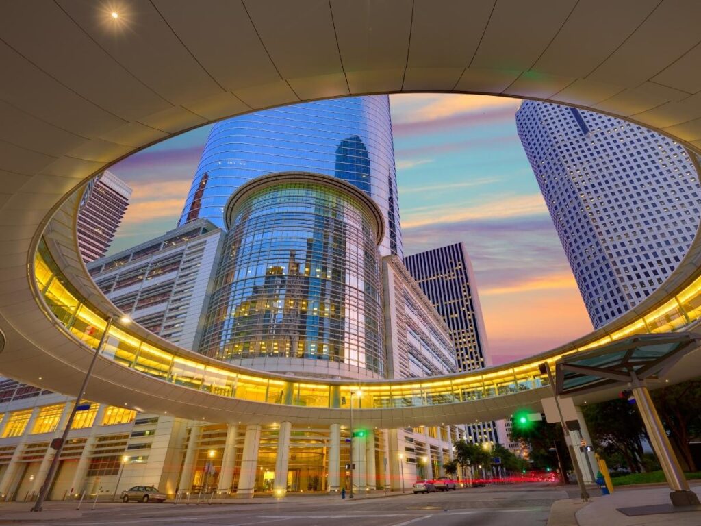 Illuminated Theater District buildings in downtown Houston at night