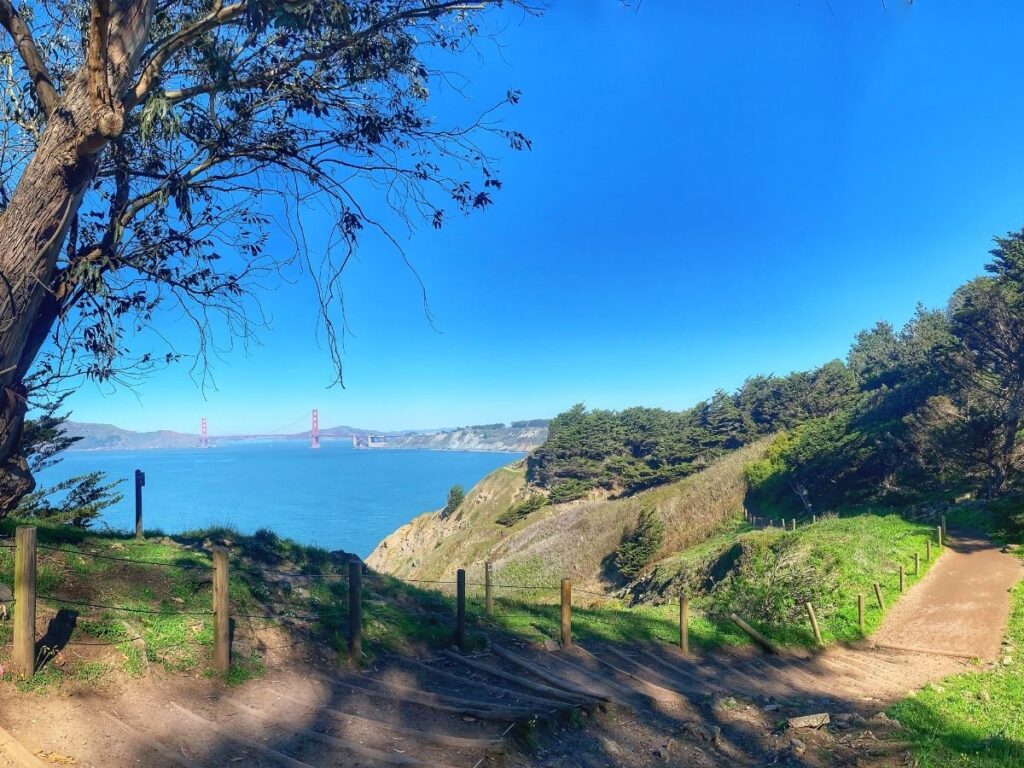 Land’s End Trail with coastal cliffs and the Golden Gate Bridge in the distance	
