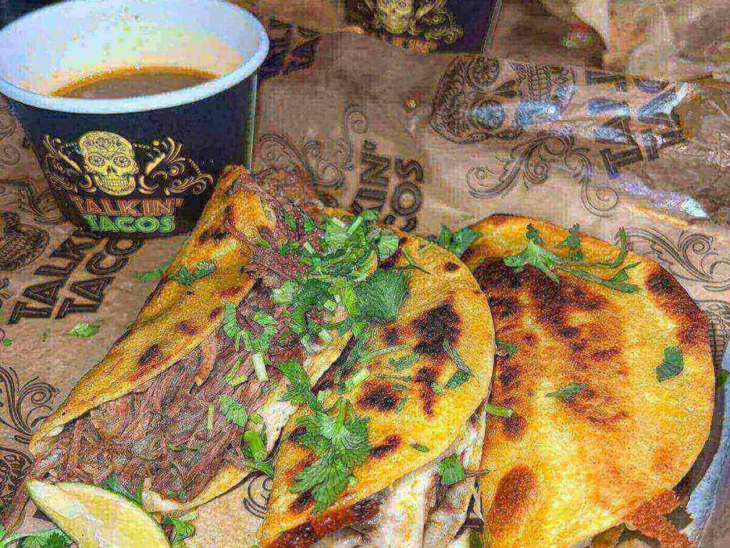 Tacos, enchiladas, and queso served at Mi Cocina in Dallas.