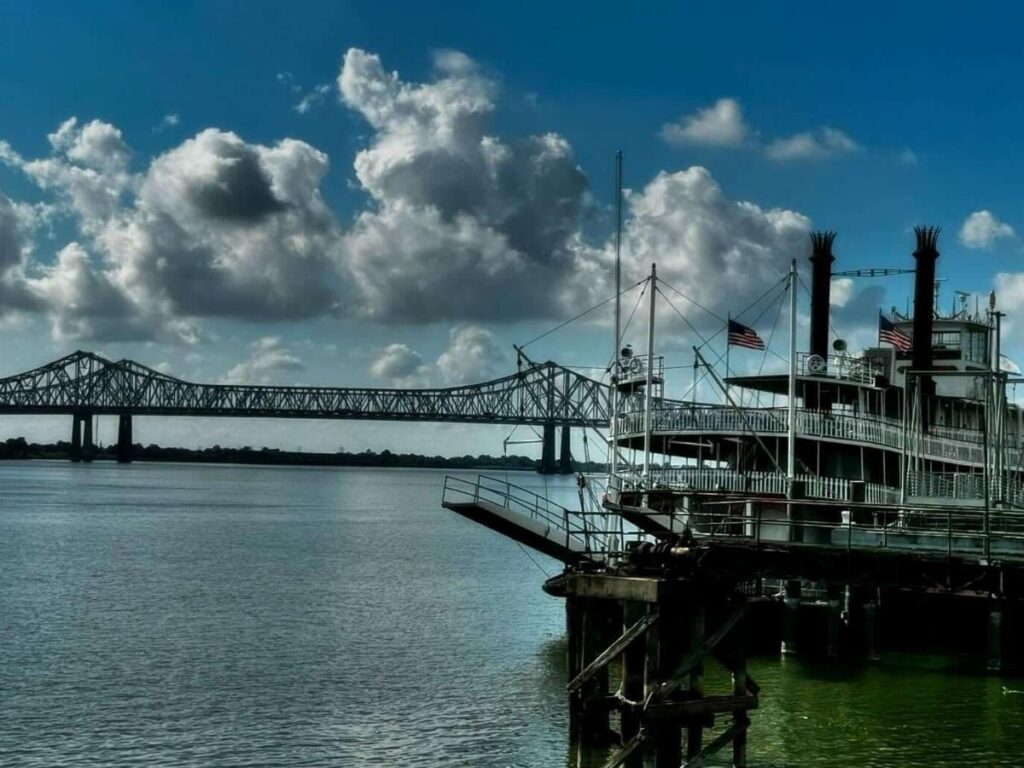 The Mississippi River flowing past downtown New Orleans on a calm day