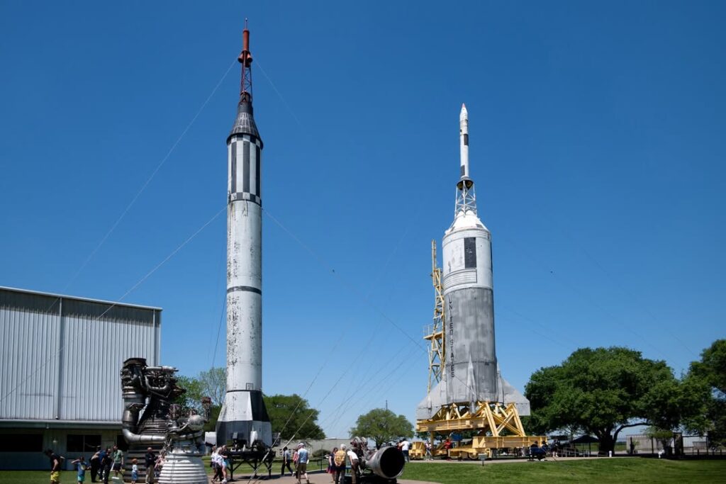 Exterior view of NASA Space Center Houston with rocket display.