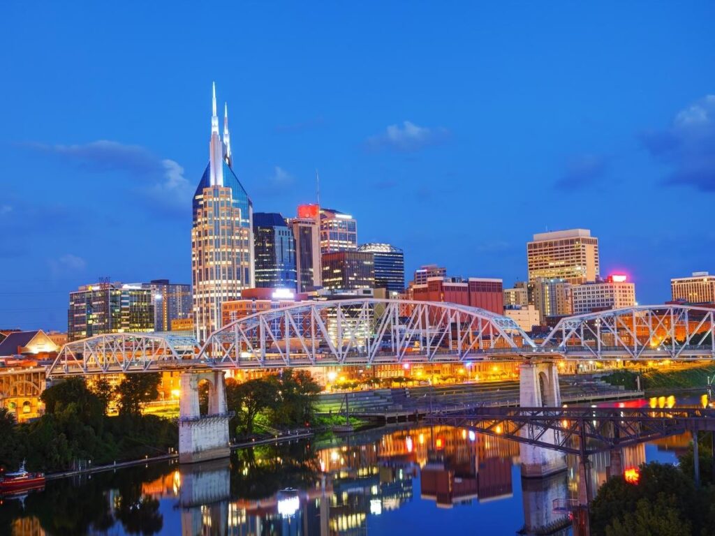 Quiet downtown Nashville street in the morning with people walking and music venues opening