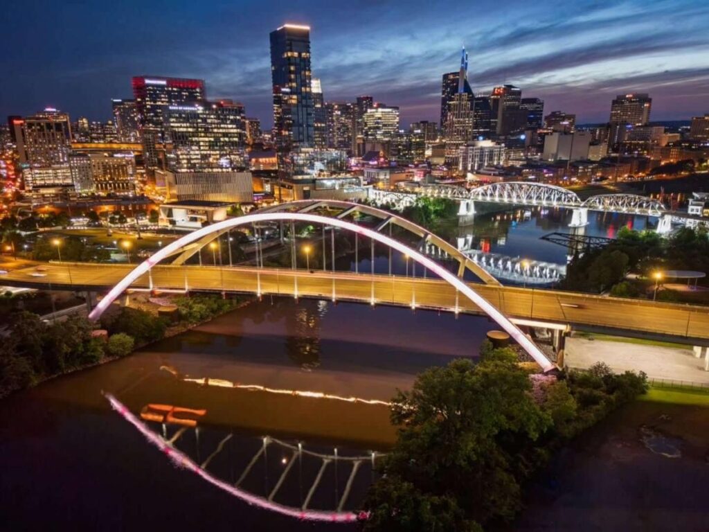 Sunset view of downtown Nashville from the pedestrian bridge over the river