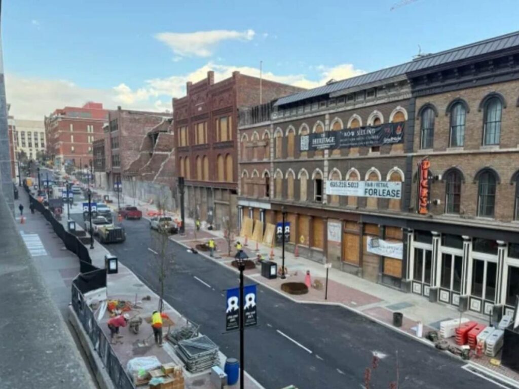 People strolling through a Nashville neighborhood without crowds
