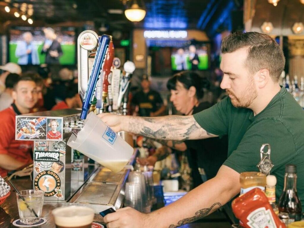 Craft beer taps and seating at Our Mutual Friend Brewing in RiNo Denver