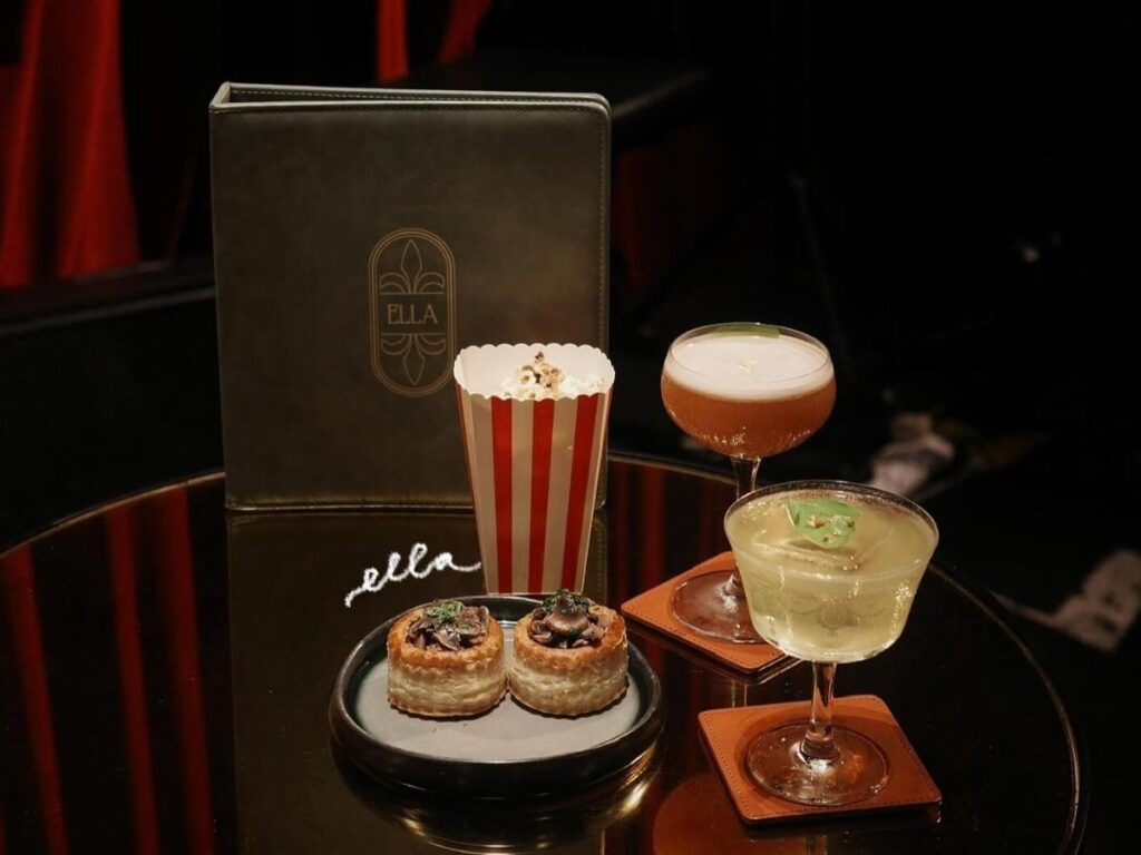 People sitting at an outdoor table in New Orleans enjoying a slow meal together