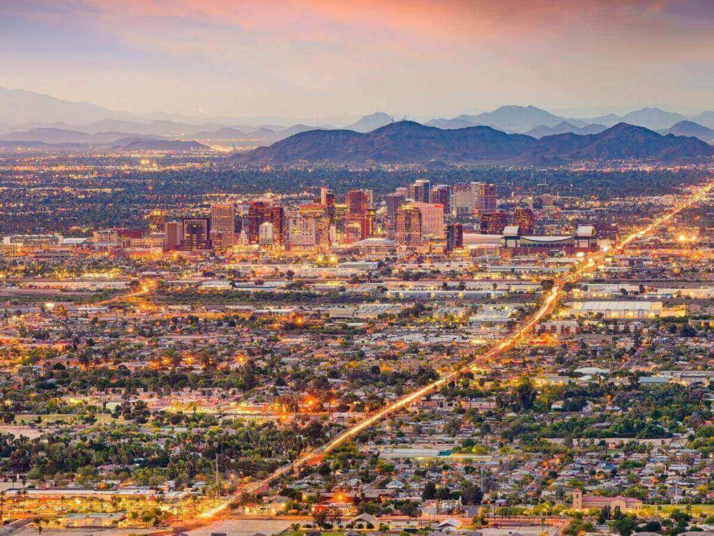Sunset over Phoenix with desert mountains and warm evening light