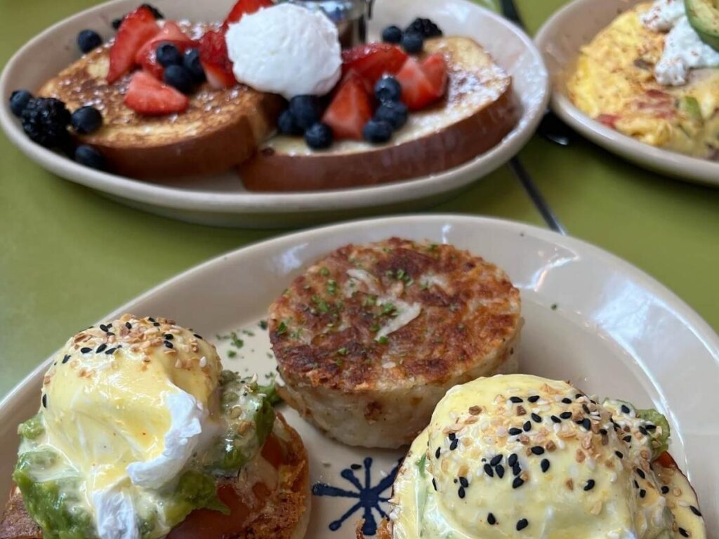 Stacked pancakes with toppings served at Snooze in Denver during brunch