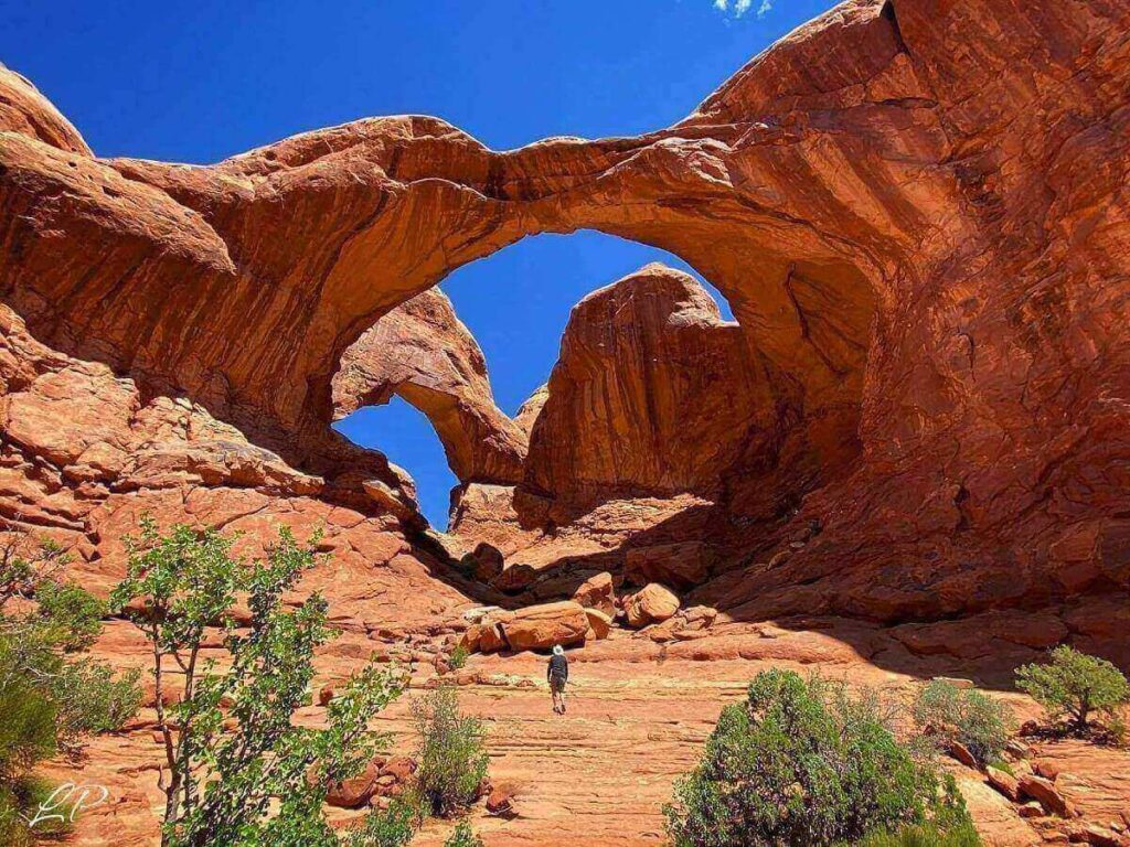 Delicate Arch in Arches National Park glowing in warm evening light
