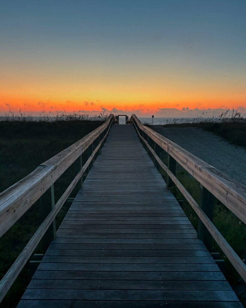 Sunset over calm waters at Back River Beach, Tybee Island