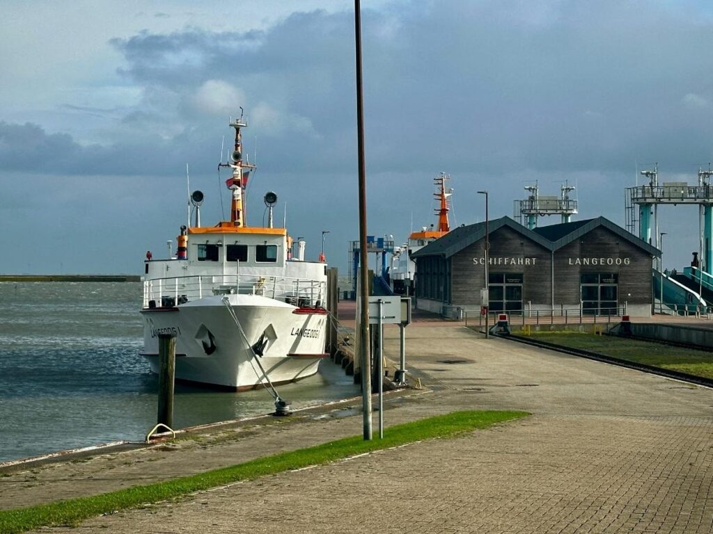 Ferry approaching Old Harbor on Block Island with the town in the background.