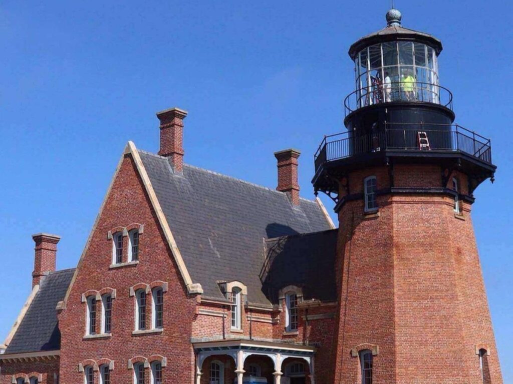 Southeast Light perched on the bluffs with ocean view.