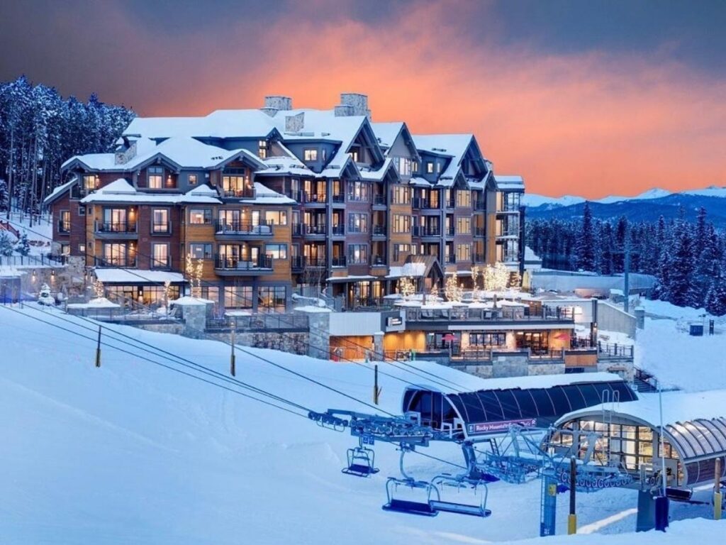 Skiers on the slopes at Breckenridge Ski Resort on a clear winter day.