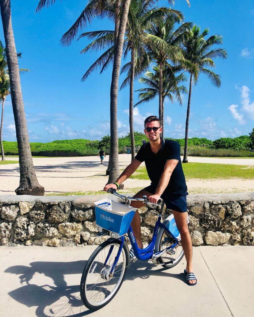 Peson on a rented CitiBike in Miami