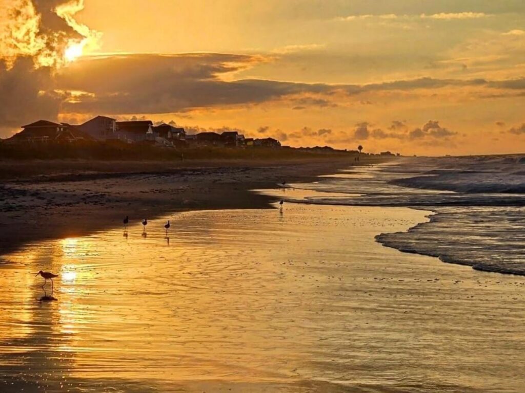 Emerald Bay at sunset with soft light over the water and surrounding cliffs