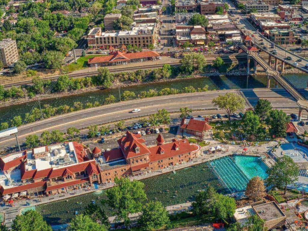 Glenwood Hot Springs pool with steam rising and canyon walls behind