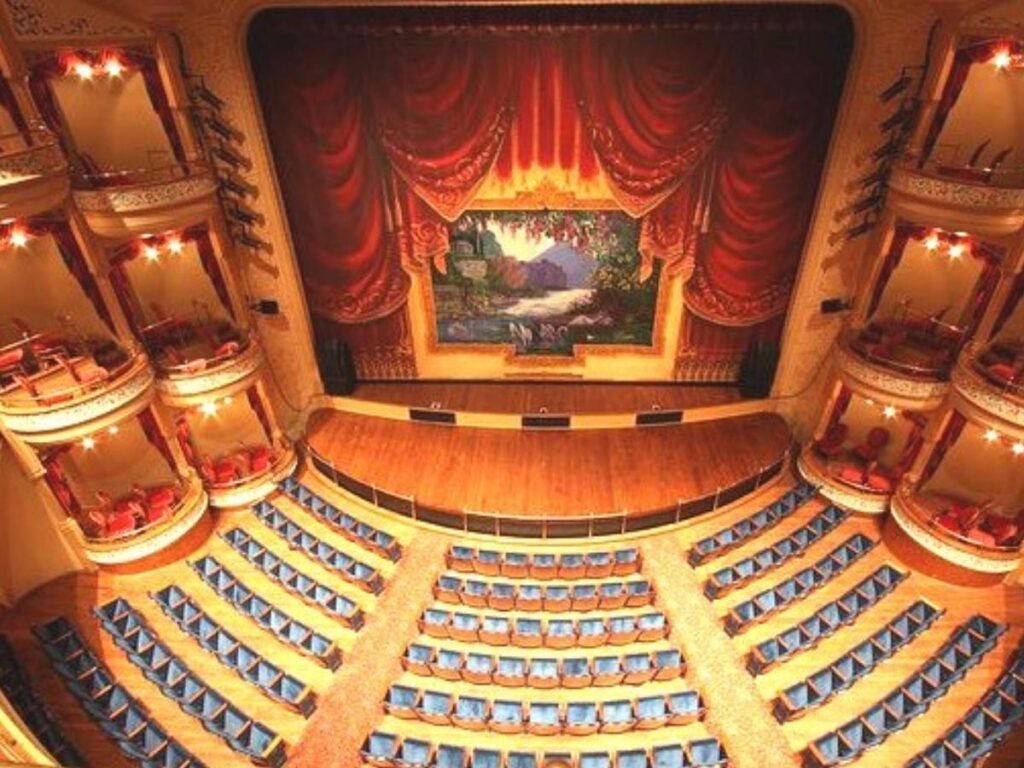 Elegant interior of The Grand 1894 Opera House in Galveston with vintage seating and ornate details