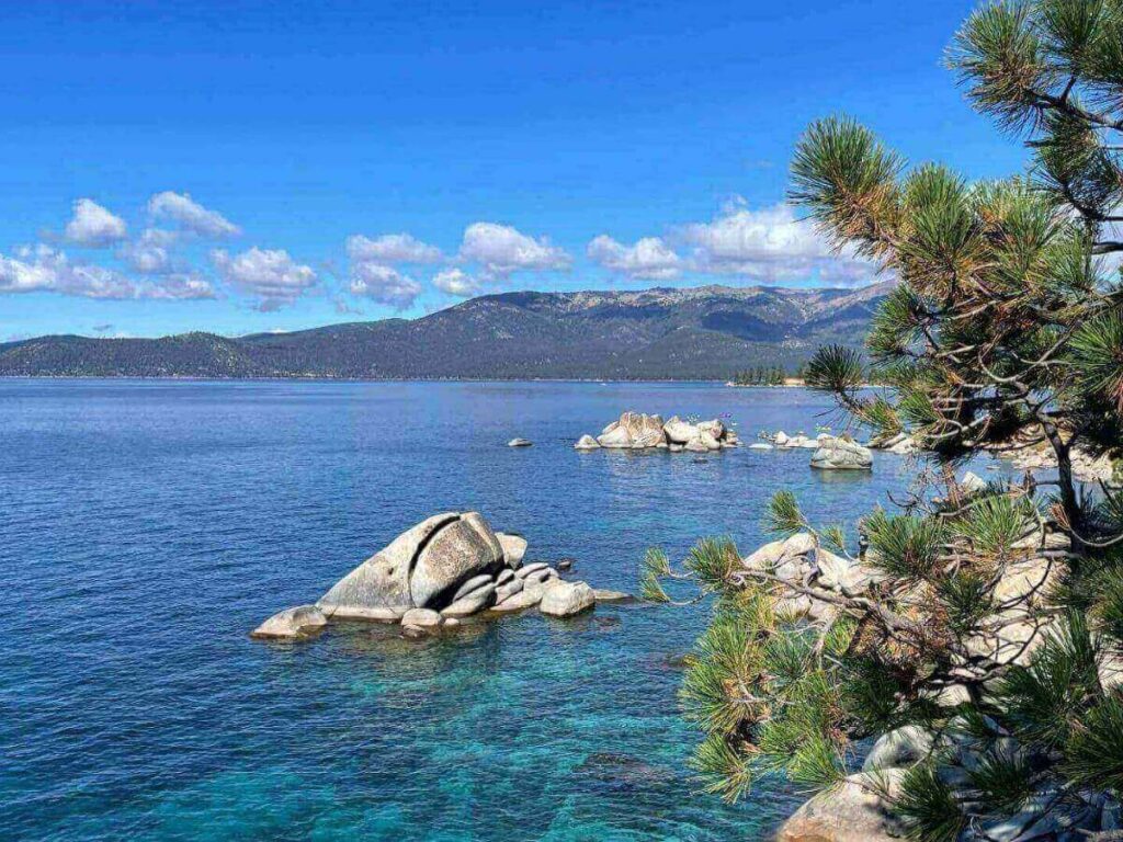 Kings Beach in North Lake Tahoe with wide shoreline and mountain backdrop