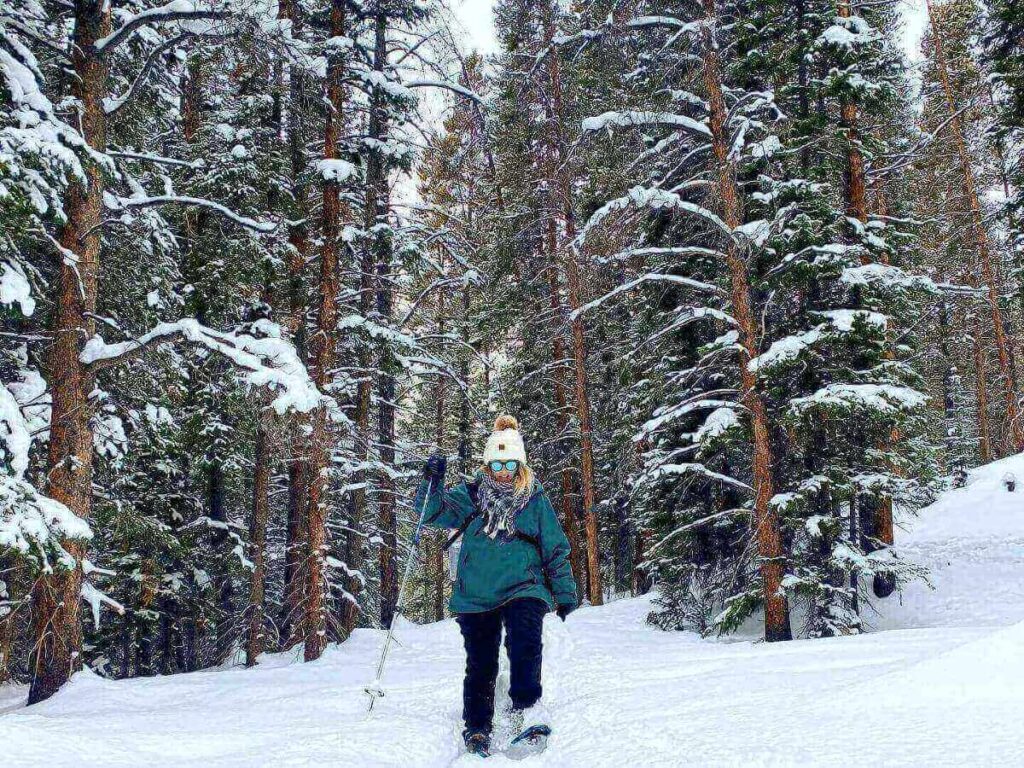 Hiking trail at McCullough Gulch with alpine lake and mountain views.