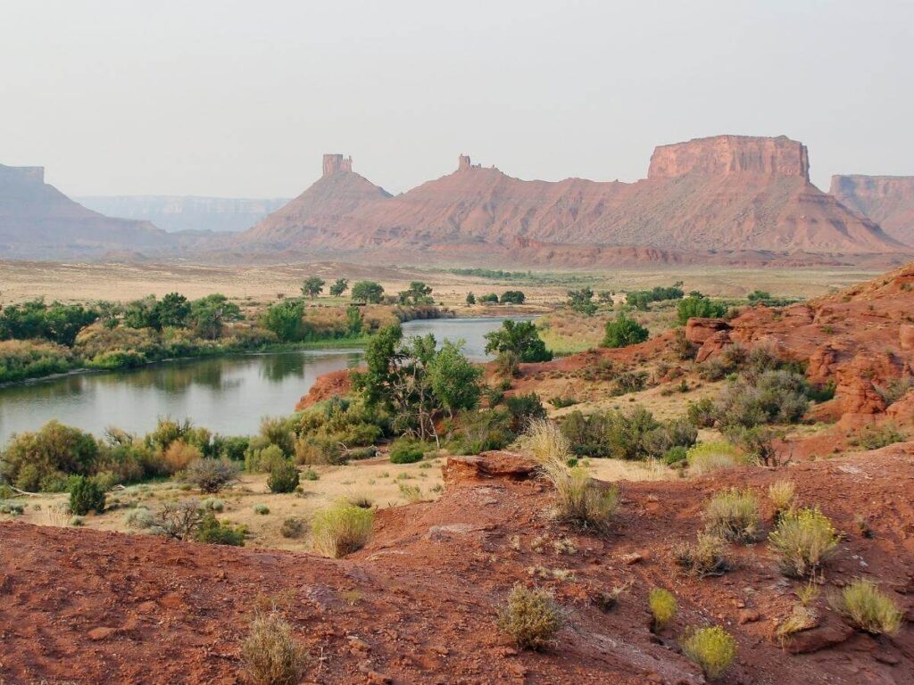 Colorado River near Moab on a summer day with canyon walls rising above the water