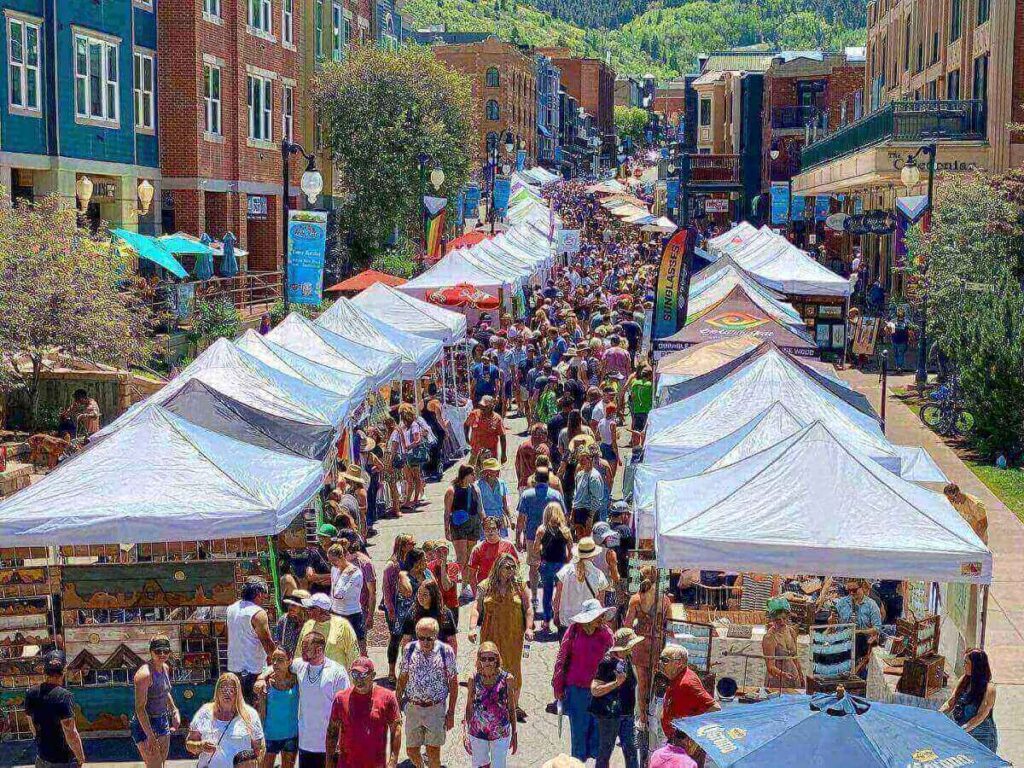 Local market in Park City with vendors and visitors