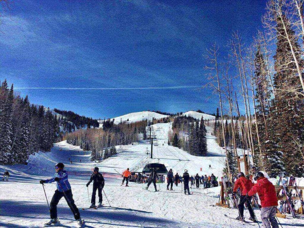 Skiers on wide ski runs at Park City Mountain