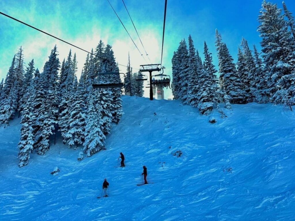 Snowy Park City during winter ski season with chairlifts and mountain views