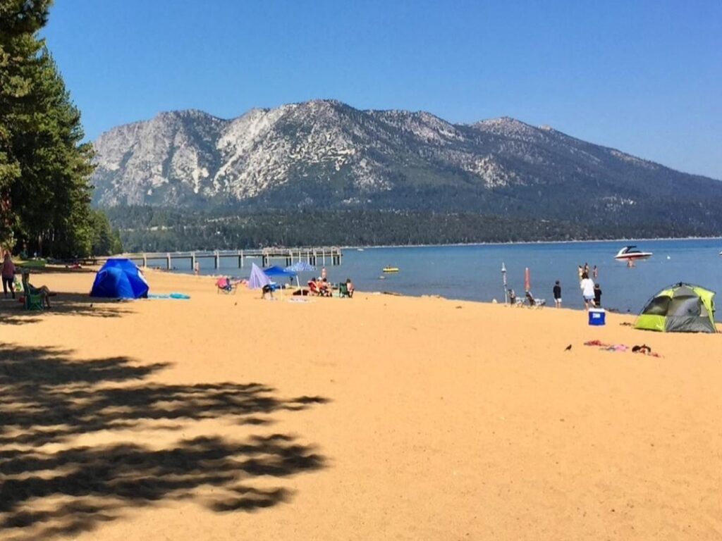 Wide sandy shoreline at Pope Beach in South Lake Tahoe on a summer afternoon