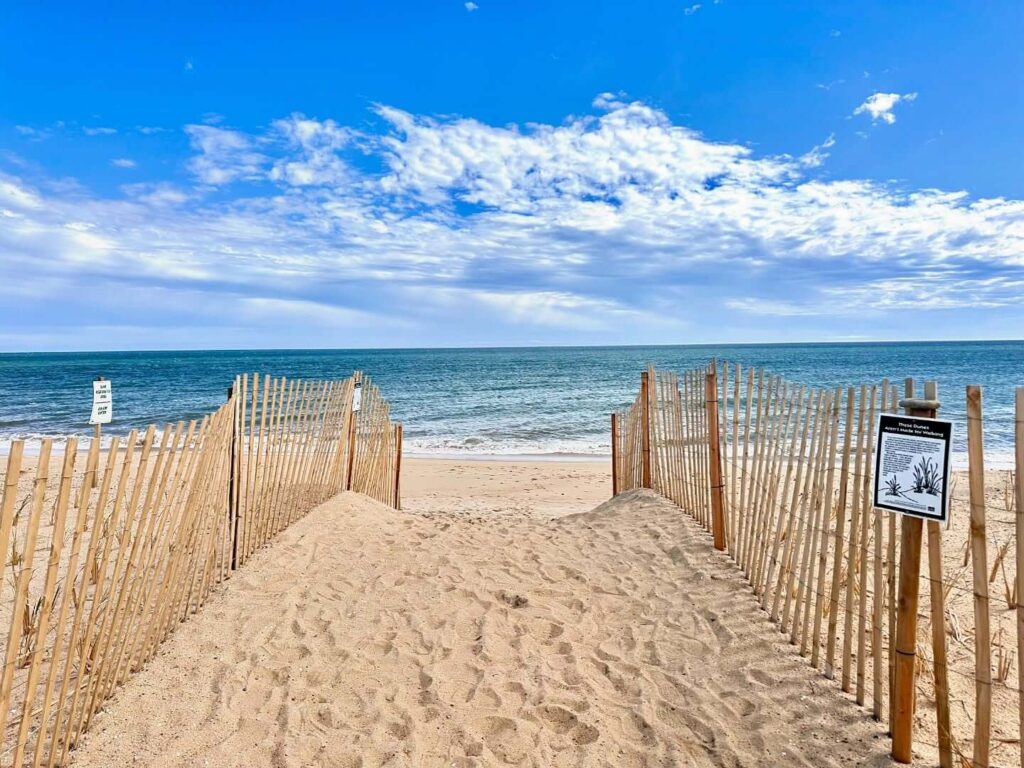 Wide sandy stretch of South Beach with waves rolling in Martha’s Vineyard