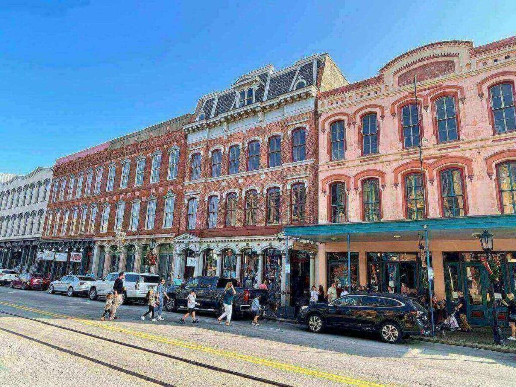 Brick streets and colorful Victorian storefronts in The Strand Historic District in Galveston, Texas
