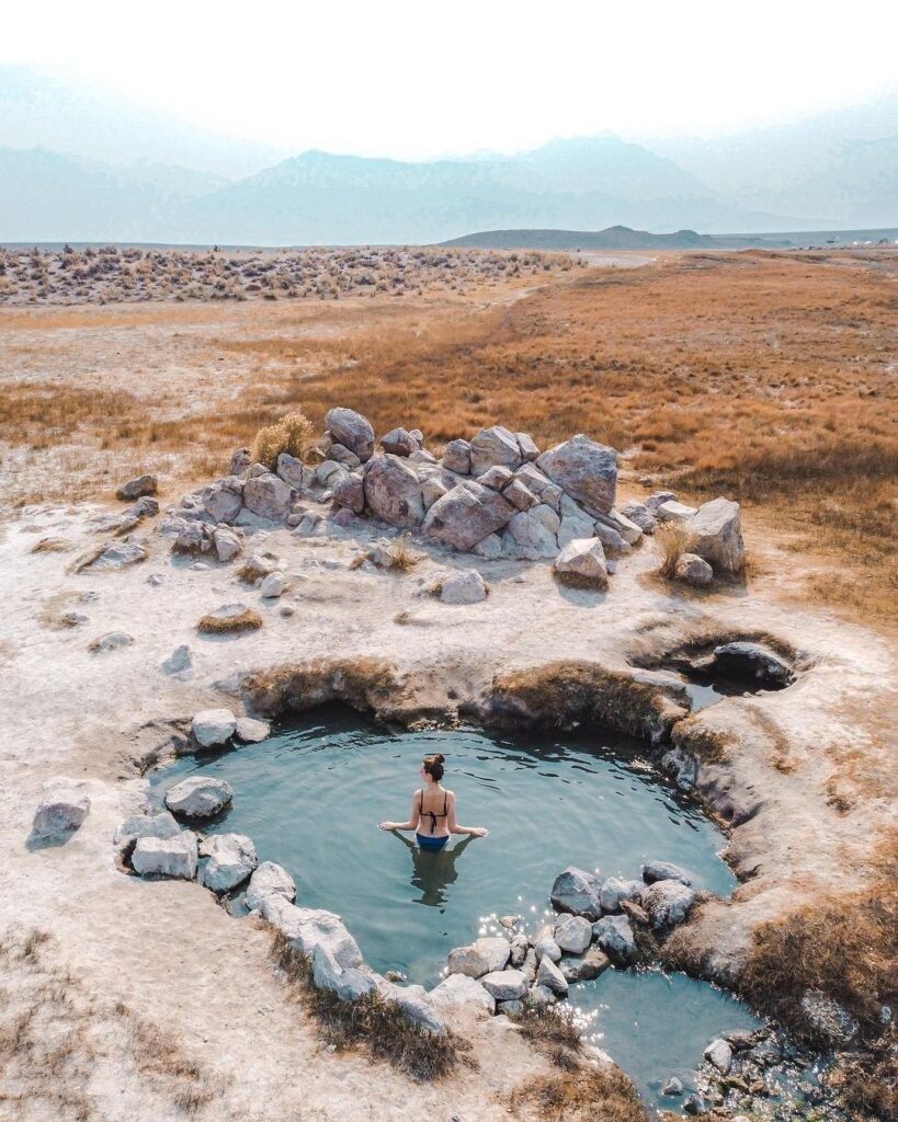 Natural hot spring pools at sunrise in Mammoth’s open meadow