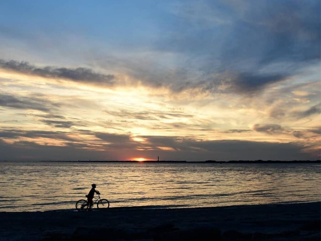 Aerial view of East Beach with waves breaking along the shoreline.