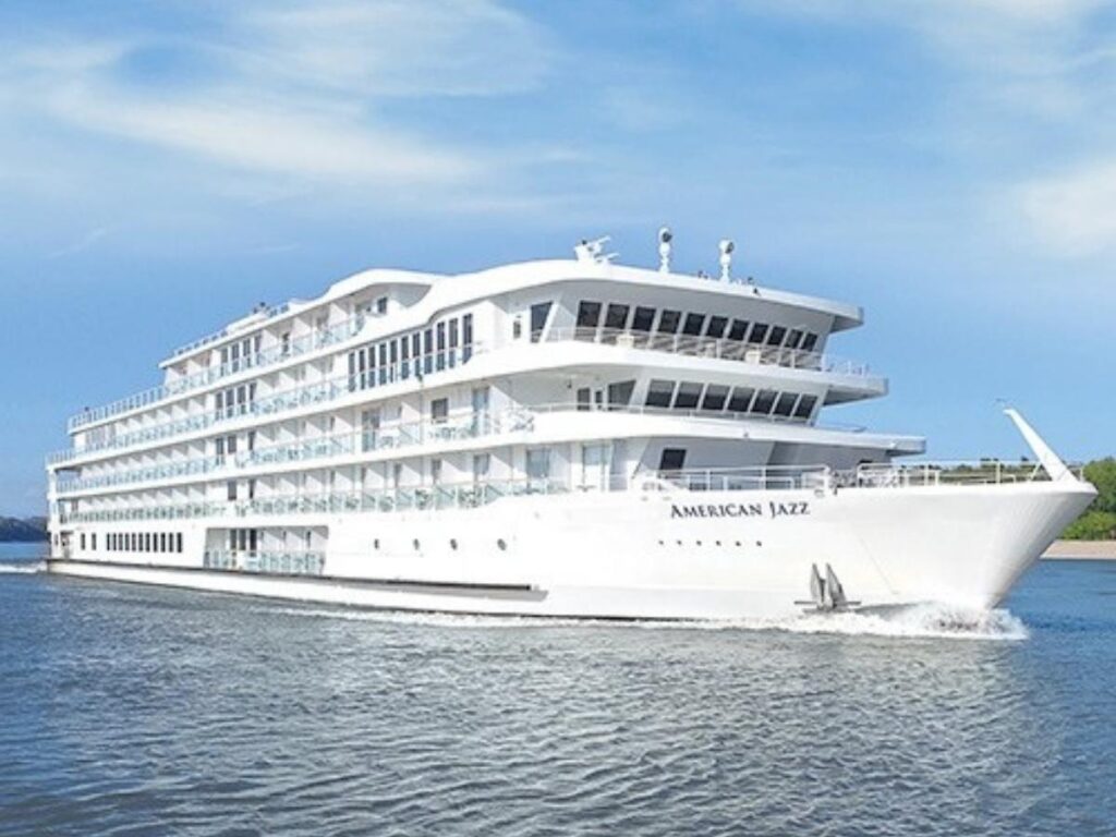 Boat sailing along Amelia River during golden hour with sunset over salt marshes