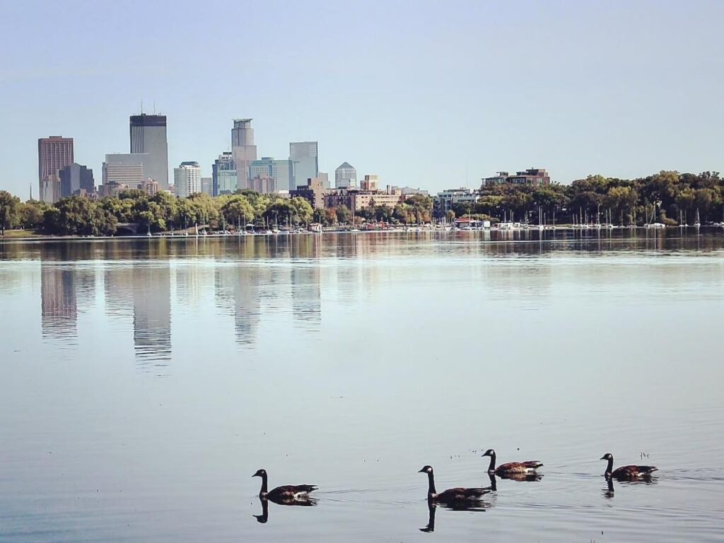 Morning along Bde Maka Ska with people walking and biking