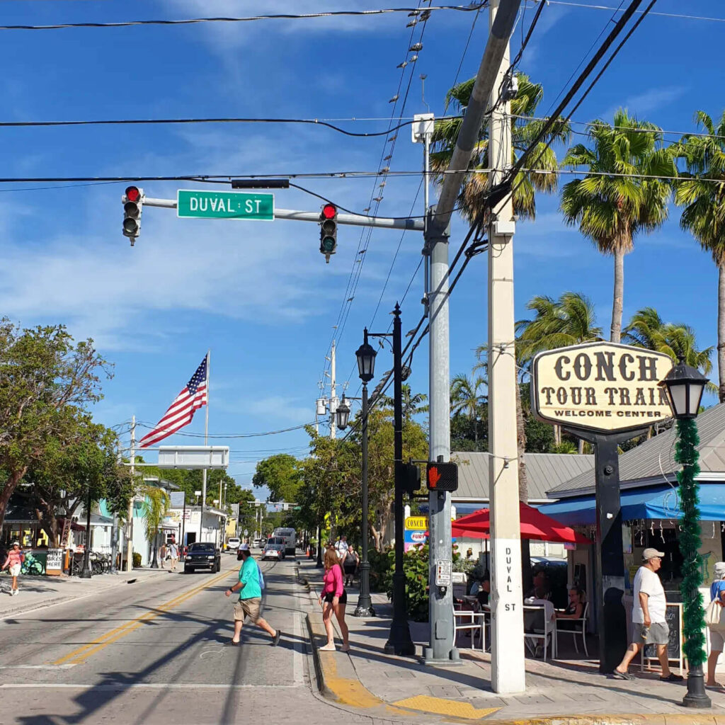 Duval Street in Key West with shops and cafes during the day