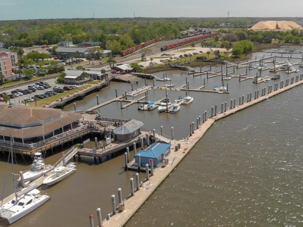 Colorful Victorian-style buildings and palm-lined sidewalks in historic downtown Fernandina Beach on Amelia Island