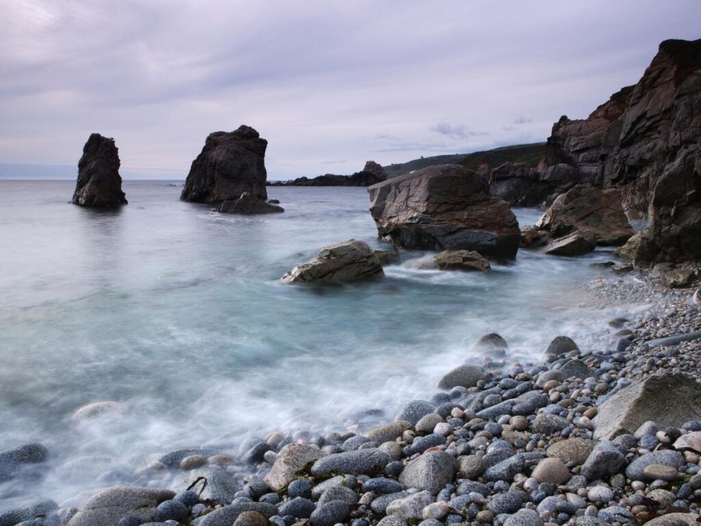 Waves crashing against the rugged cliffs at Garrapata State Park