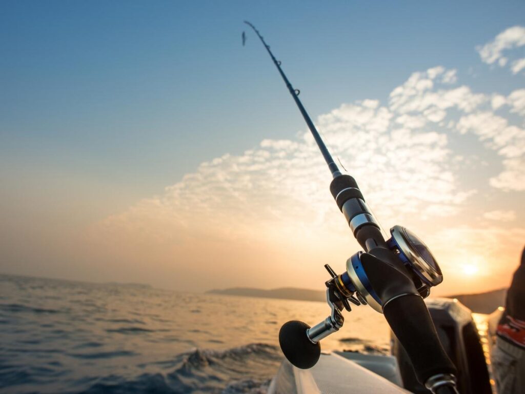 Angler casting a line from a small inshore fishing boat near Bald Head Island.