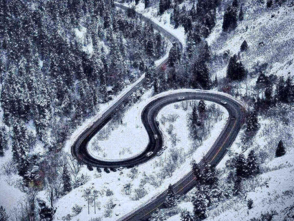 Mountain road winding through Little Cottonwood Canyon in Utah