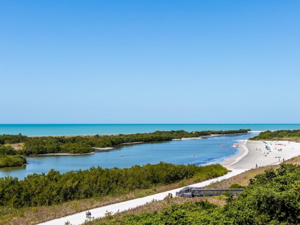 Aerial view of Marco Island coastline showing beaches, water, and surrounding greenery