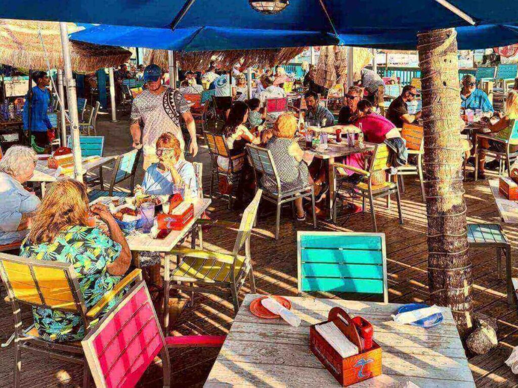 Evening waterfront dining on Marco Island with soft light and calm water