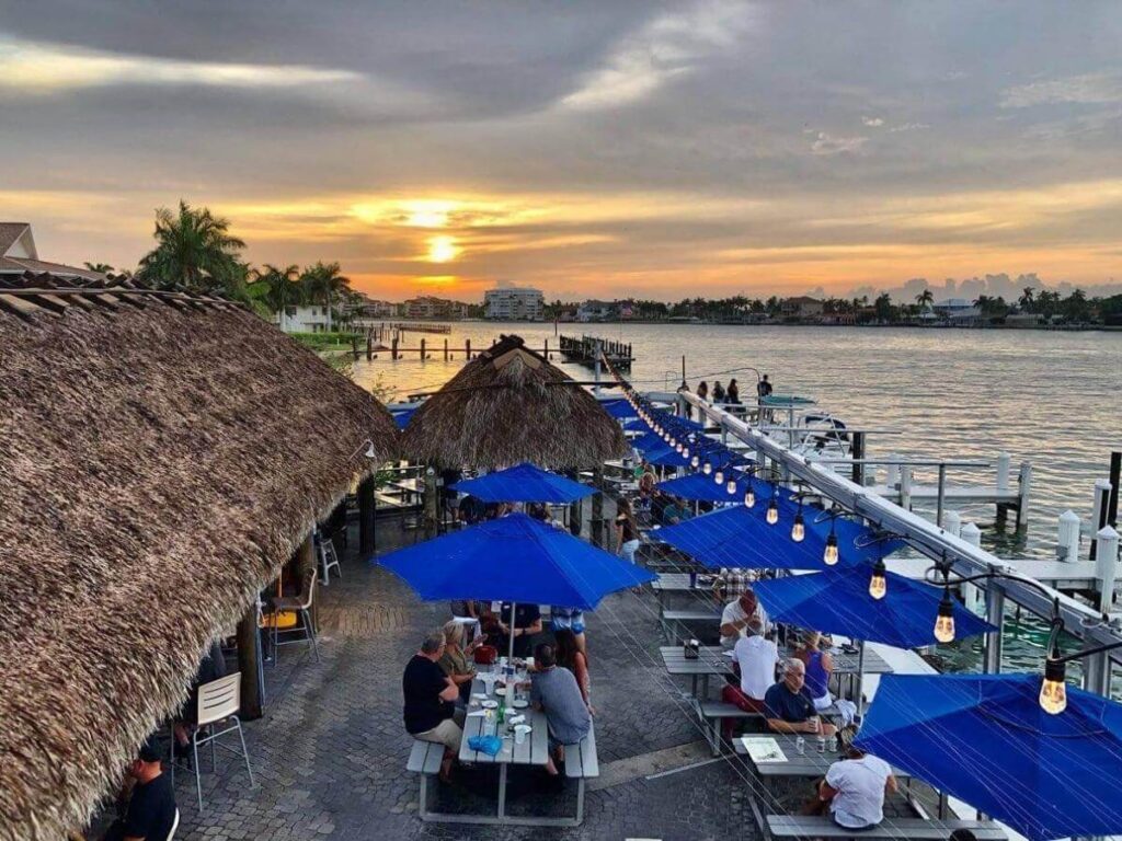 Waterfront restaurant on Marco Island during sunset with tables overlooking the Gulf