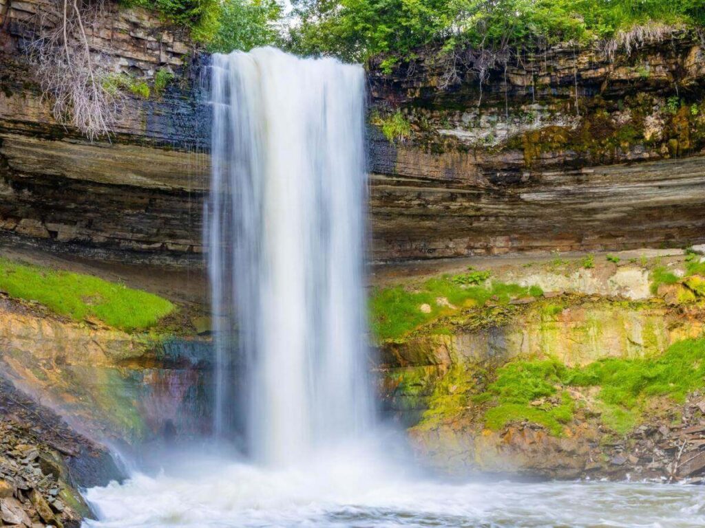 Trail leading toward Minnehaha Falls surrounded by trees