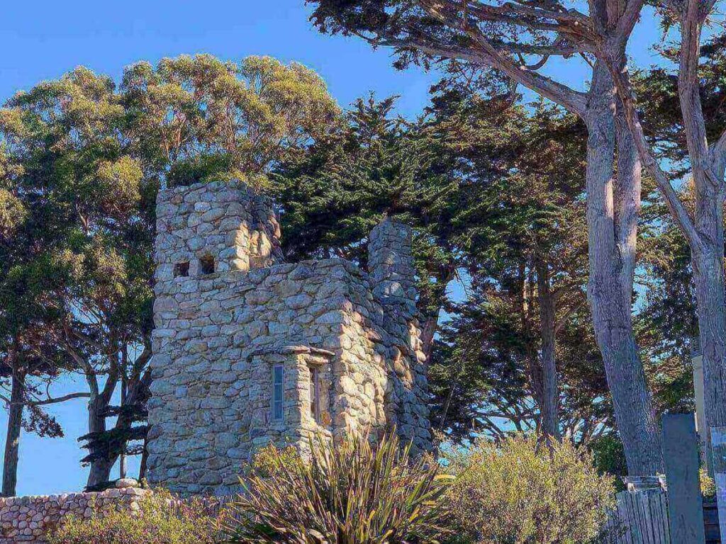 Tor House and Hawk Tower perched on a bluff overlooking the Pacific Ocean
